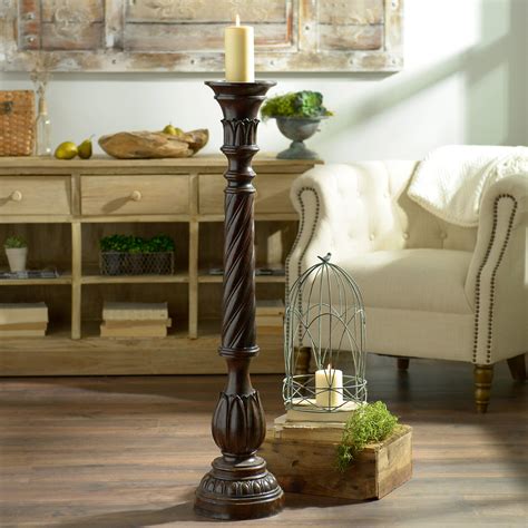 large floor standing wooden candle holders.